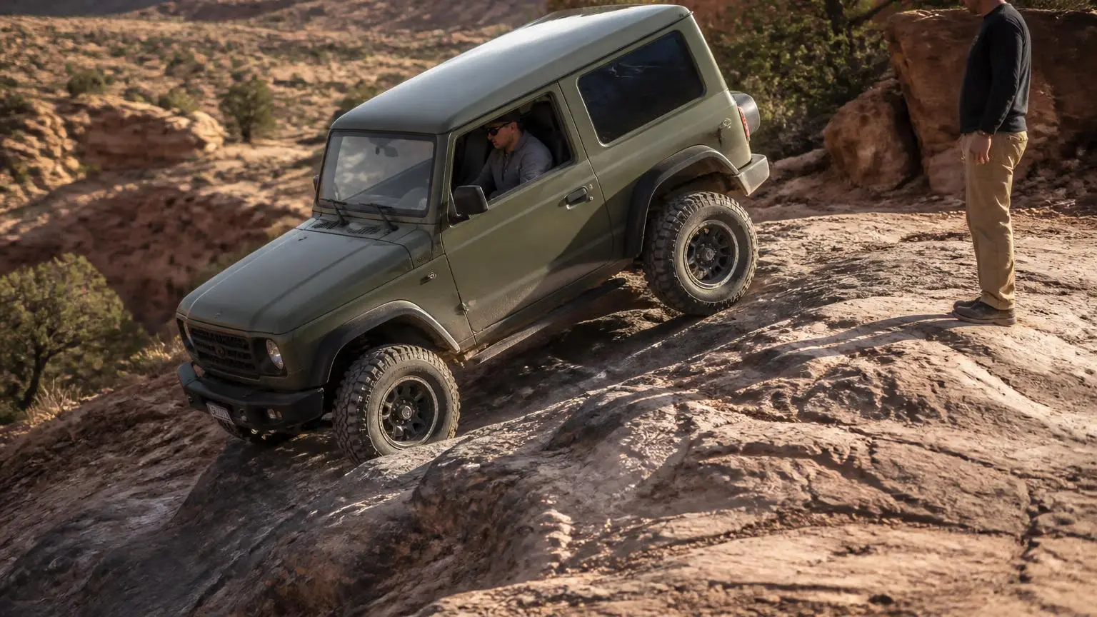 A 4WD crawling down a steep rocky descent in low range
