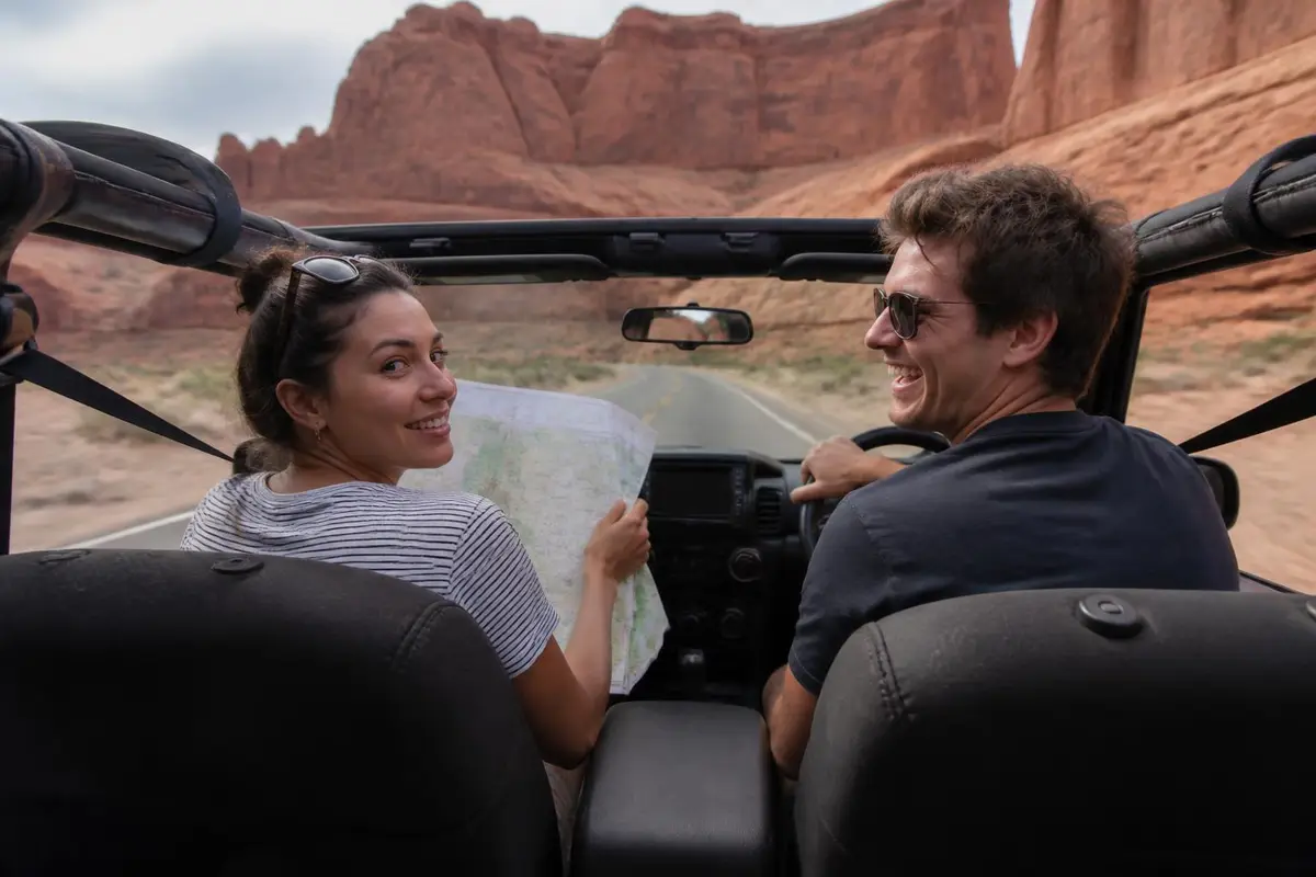 Open-top off-roader interior with a passenger reading a map