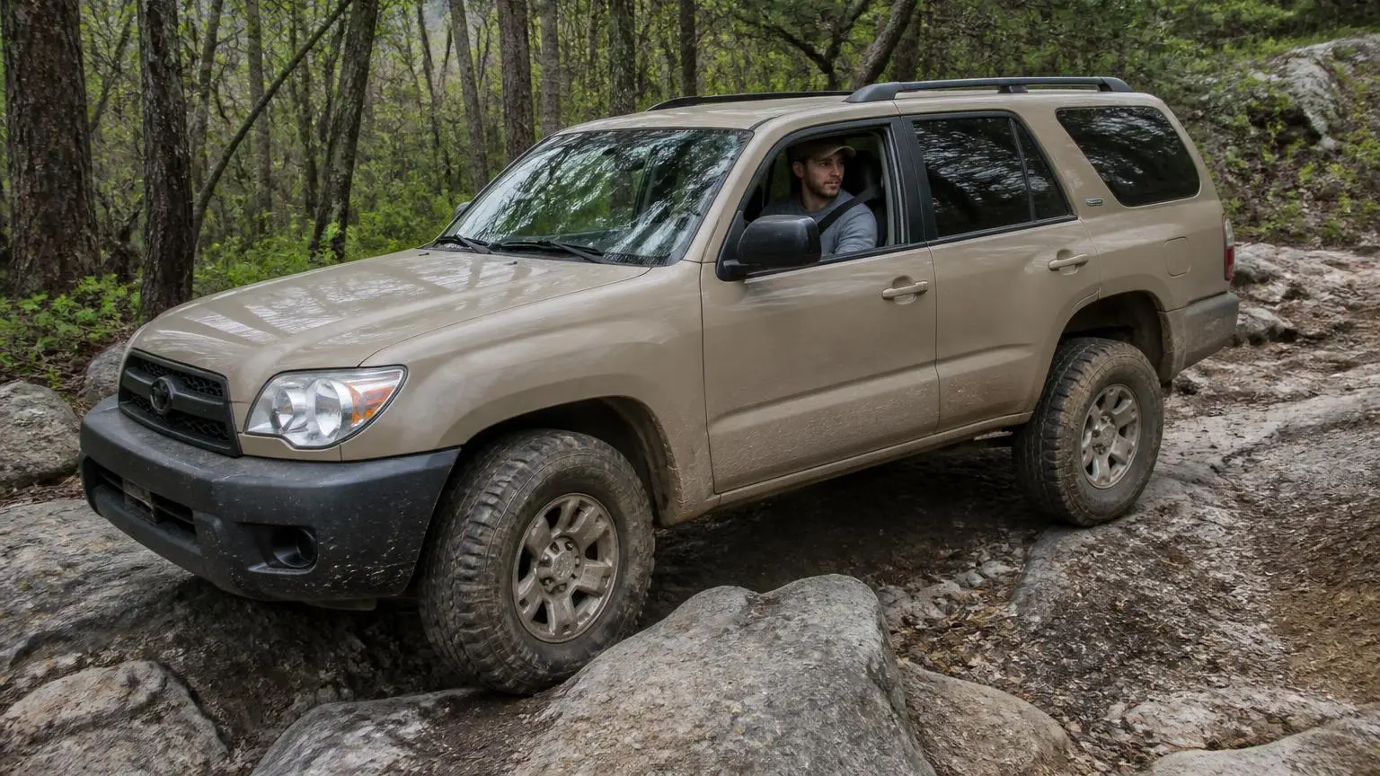 Illustrative: a 4WD crawling a rocky forest trail in the North Carolina piedmont