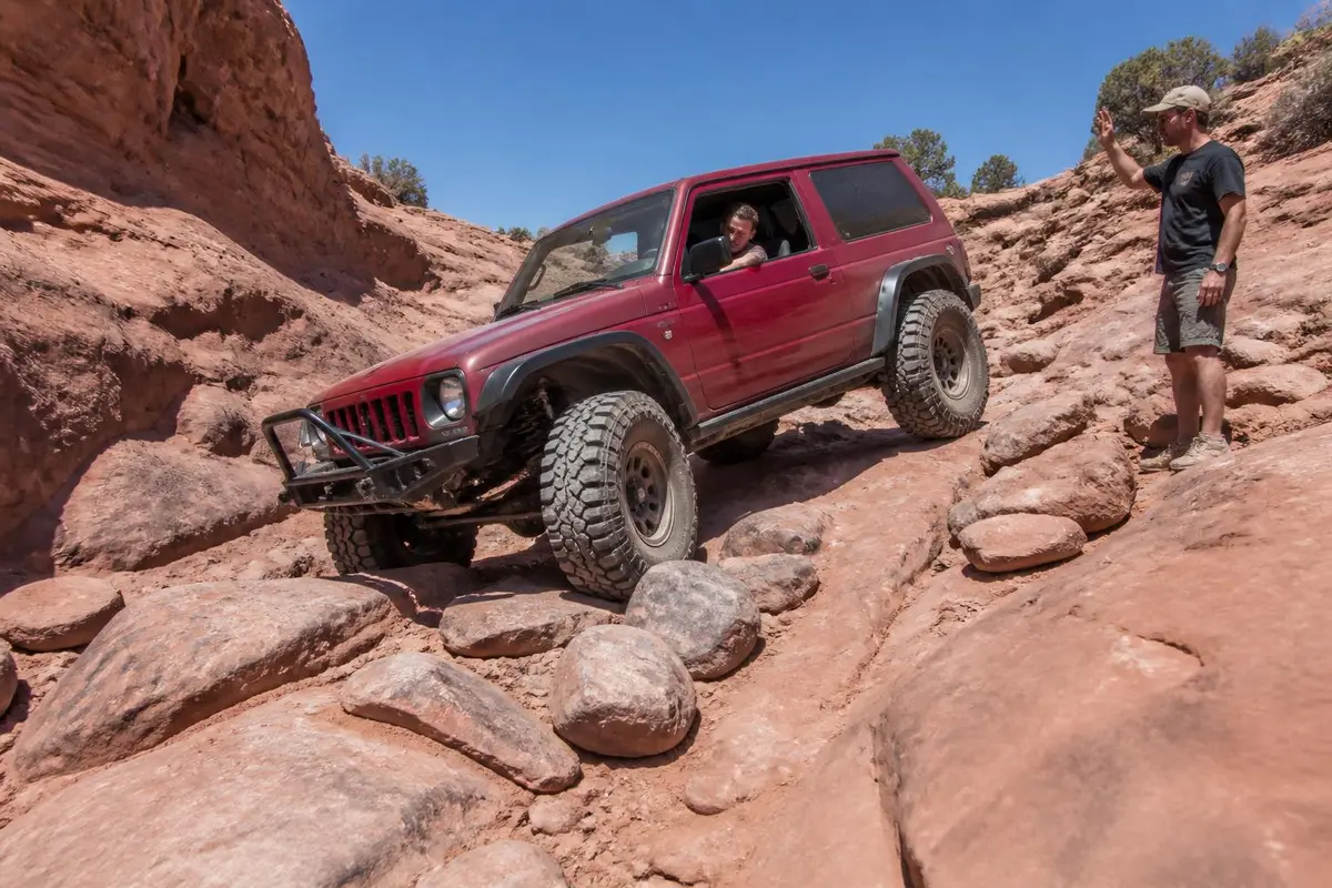 Off-roader tackling a rated rocky trail section
