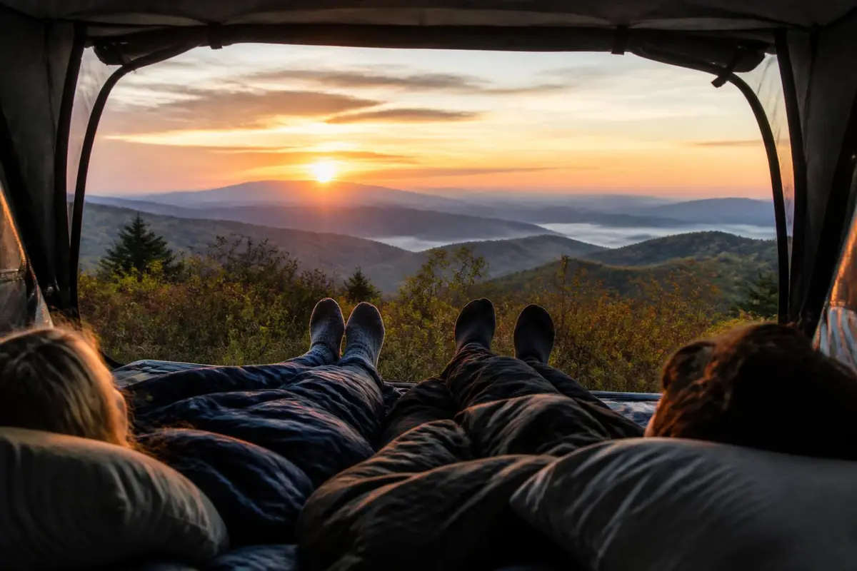 Inside a truck bed tent looking out at sunrise